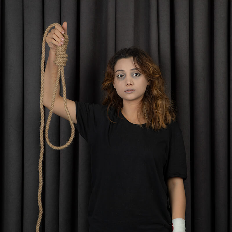 portrait-of-depressed-young-girl-holding-hangman-s-2023-11-27-05-13-01-utc-1.jpg